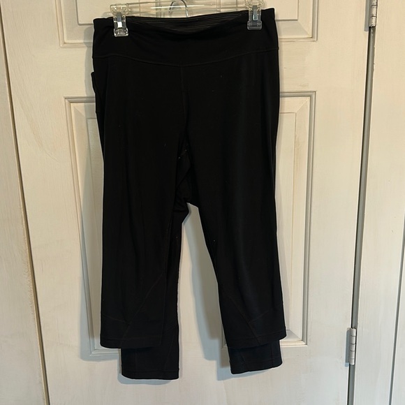 Under Armour Pants - 2 pair of under armour black Capri leggings women’s size medium